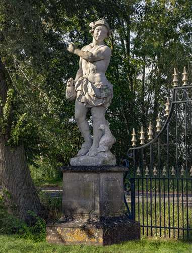 A Continental sculpted limestone group of Mercury and a cock...