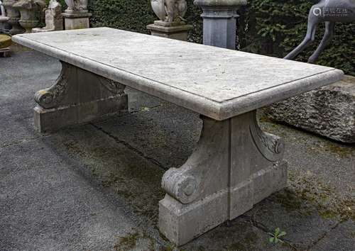 A carved limestone refectory garden table