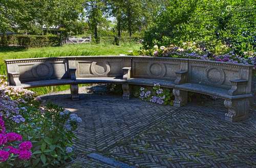 A Continental carved limestone exedra seat