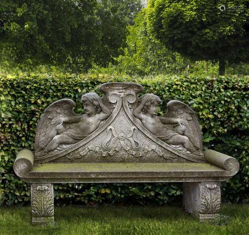 A carved limestone garden bench in Louis XIV style