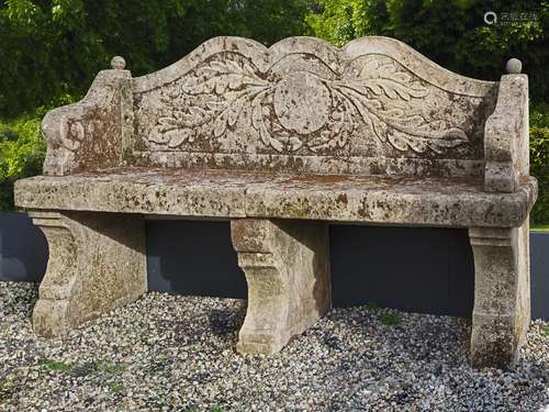 A carved limestone garden seat in 18th century style