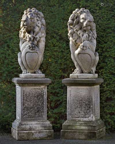 A pair of sculpted limestone models of heraldic lions