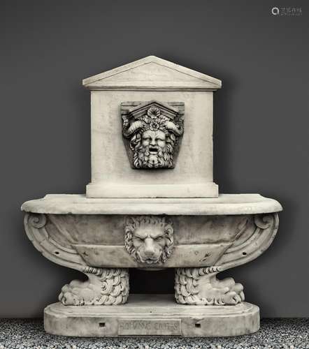 A sculpted white marble wall fountain and basin in the Renai...