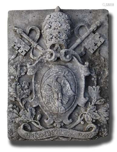 A sculpted limestone armorial panel