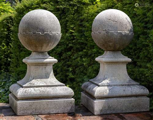 A pair of carved limestone pier finials