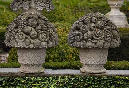 A pair of large Continental carved limestone baskets of flow...