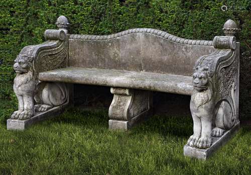 A carved limestone garden seat in 18th century style