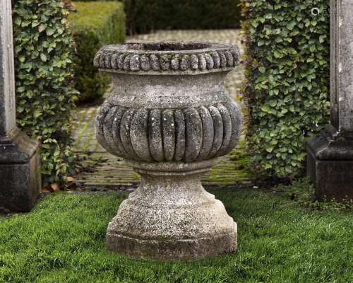 A Continental carved stone garden urn