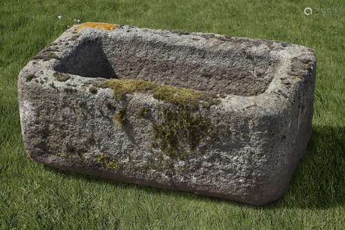 A carved limestone trough