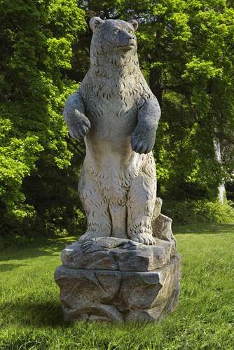 A sculpted limestone model of a Grizzly Bear