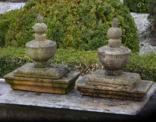 A pair of French carved sandstone pier finials