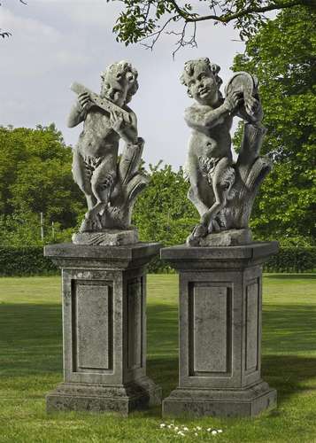 A pair of Continental sculpted limestone models of infant mu...