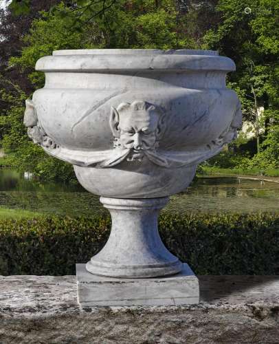 A sculpted Carrara marble garden urn