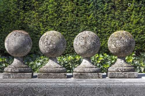 A set of four carved limestone pier finials