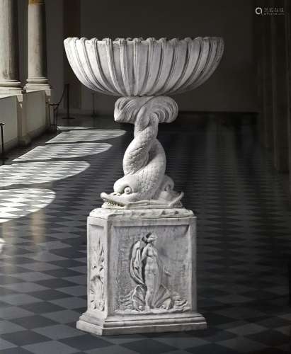 A Continental sculpted white marble basin on plinth