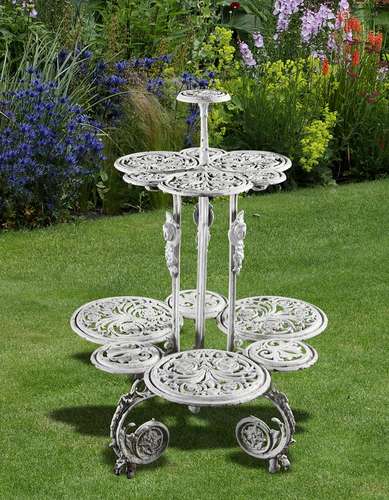 A white painted cast iron conservatory jardinière stand