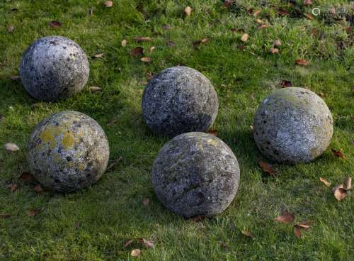 A group of five limestone ornamental spheres