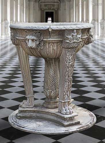 A sculpted marble planter in the manner of a Roman marble ba...