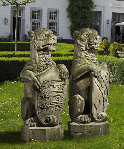 A pair of sculpted sandstone pier finials carved as heraldic...