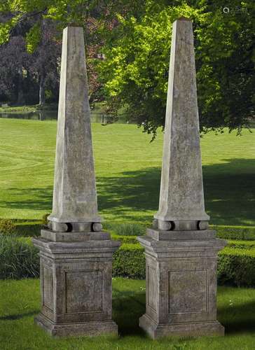 A pair of Continental limestone obelisks