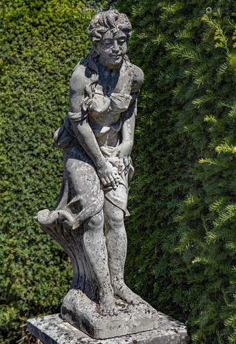 A sculpted limestone model of a standing female