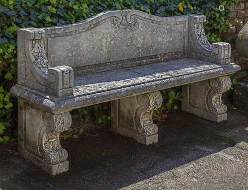 A carved limestone garden seat in 18th century style