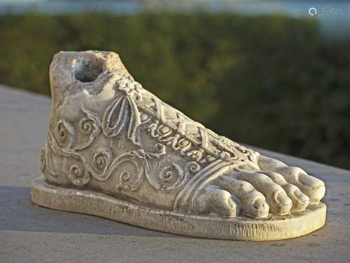 A sculpted marble model of a foot