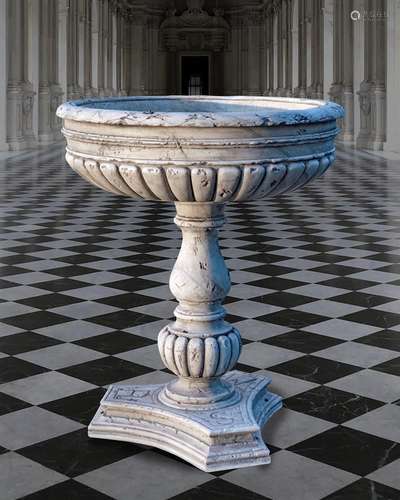 A sculpted white marble planter in the manner of a font or b...