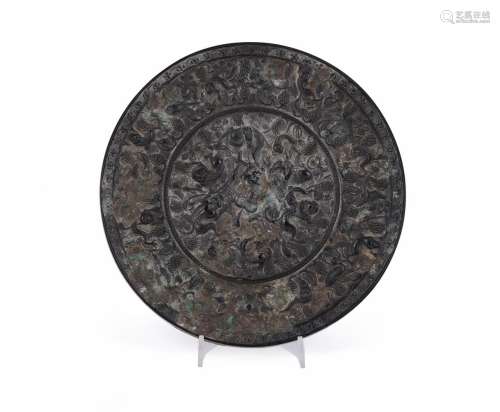 A Chinese bronze 'Mythical Beats and Grapevine' mirror