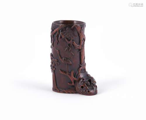 A small Chinese carved wood flower vase