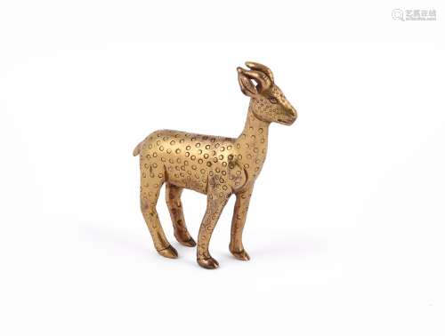 A Sino-Tibetan gilt bronze deer