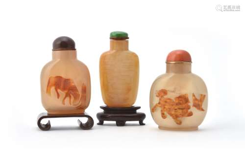 Y Three Chinese carved agate snuff bottles