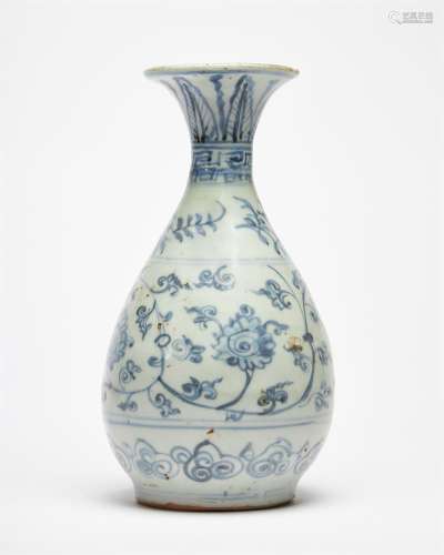 A provincial Chinese blue and white bottle vase