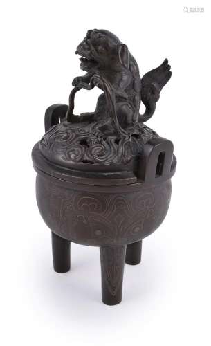 A Chinese bronze tripod censer and cover