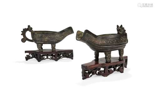 A pair of Chinese ritual bronze archaistic pouring vessels