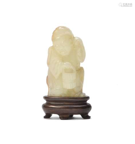 A Chinese white and russet jade figure of Zhou Tanzi