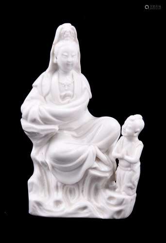 A fine Chinese Dehua moulded group of Guanyin