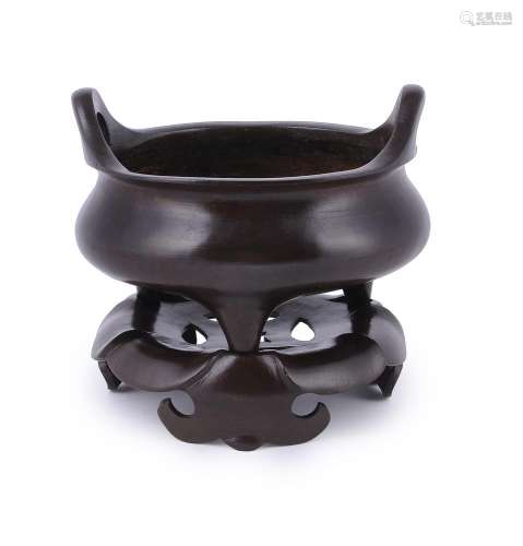 A large Chinese bronze circular incense burner and stand