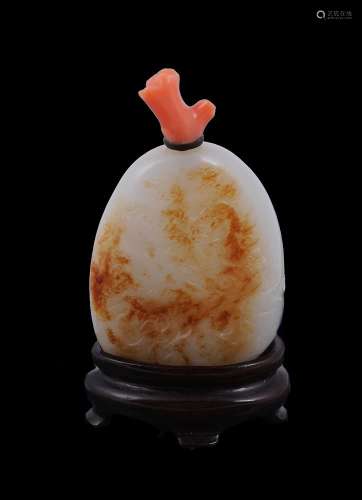 Y A Chinese russet and white jade pebble-form snuff bottle