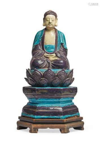 A Chinese blue and aubergine Fahua-glazed pottery figure of ...