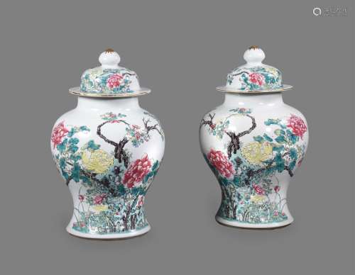 An attractive pair of Chinese Famille Rose vases and covers