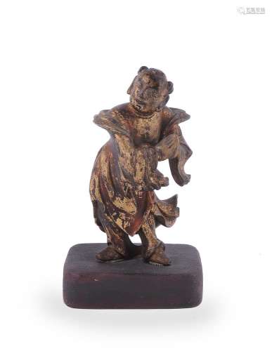 A Chinese gilt and lacquered wood figure of a boy