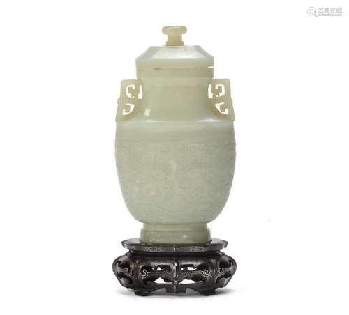 A Chinese pale celadon jade archaistic vase and cover