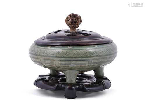 A Chinese celadon-glazed tripod censer