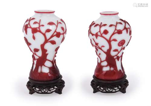 A pair of Chinese red overlay white Peking glass 'Bird and P...