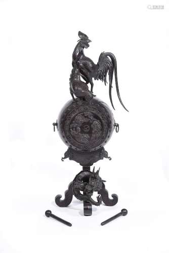 A Japanese Bronze Model of a Taiko Drum on a stand around wh...