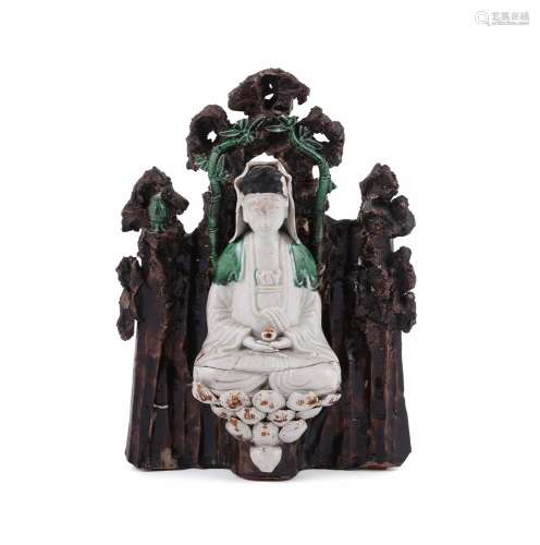 A Chinese porcelain group of Buddha within a grotto