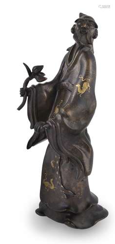 A well modelled gilt and silver wire inlaid figure of a sage