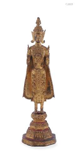 A Thai gilt-bronze standing Buddha