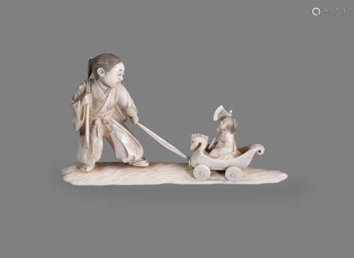 Y A Japanese Ivory Okimono of a young man standing on a shap...